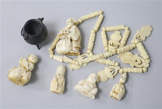 Five ivory netsukes and a bone necklace